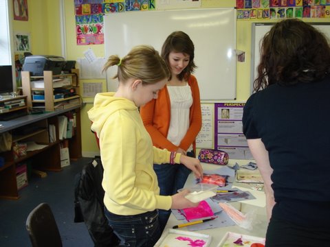 Group reviewing art class work