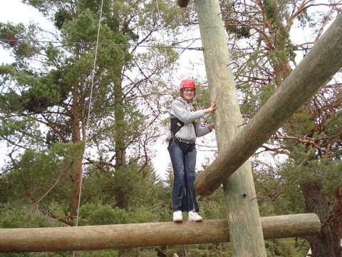 Girl on high beam obstacle course